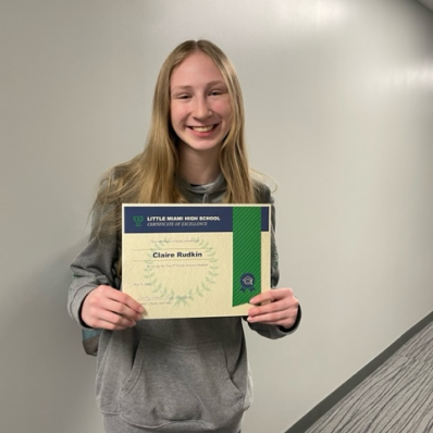 students smiling holding certificate